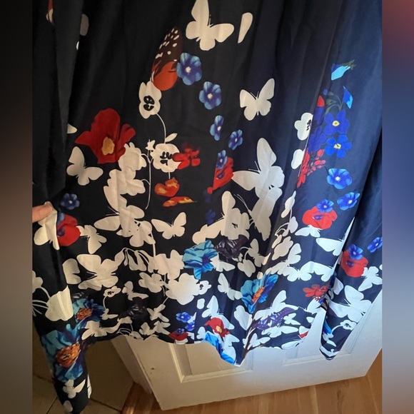 BloomChic ruffled sleeveless navy dress covered in butterflies. Below the knee. - Picture 2 of 7